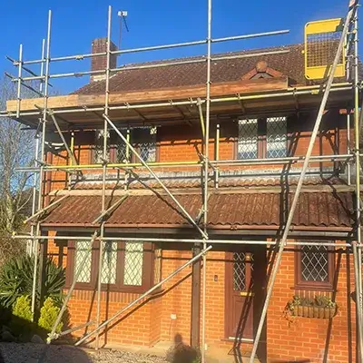 a brick building with scaffolding around it